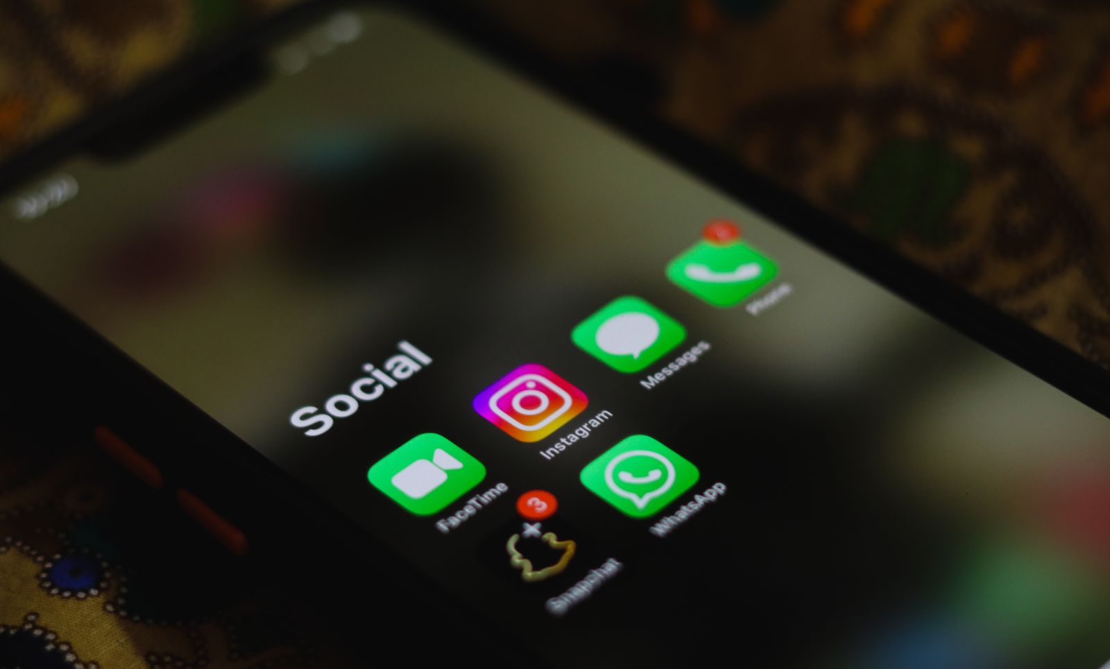 Phone displaying social media feed and content grid