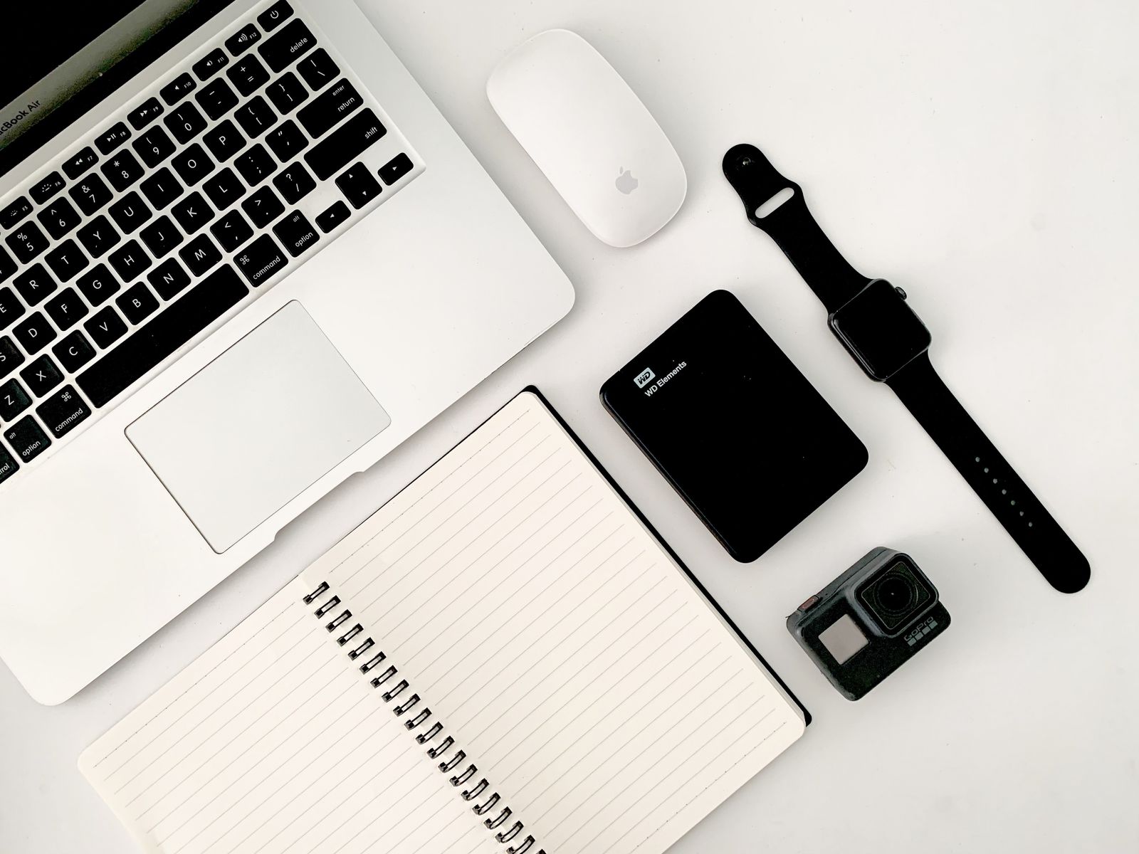 A tidy desk with a notebook, laptop and coffee â€” where marketing experiments happen